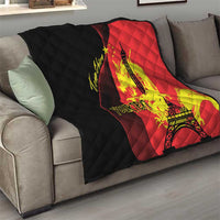 Red and black quilted throw with Eiffel Tower and dragon graphics on sofa