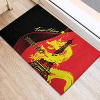 Rubber doormat with red and black design featuring yellow dragon and Eiffel Tower