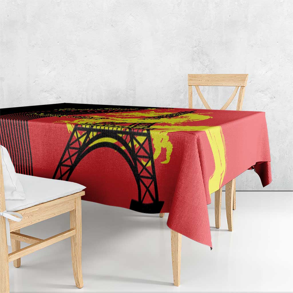 Red tablecloth with black Eiffel Tower arch and yellow dragon swirl pattern