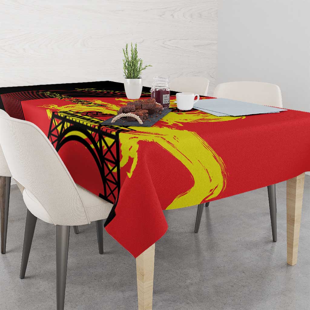 Red tablecloth draped on dining table with Eiffel Tower and yellow dragon print