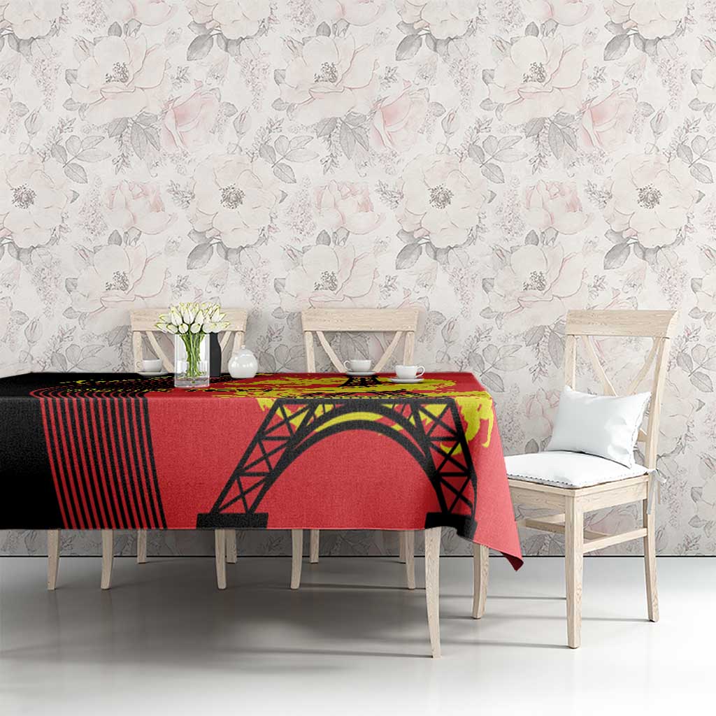 Red tablecloth with black Eiffel Tower arch and yellow dragon print on bench
