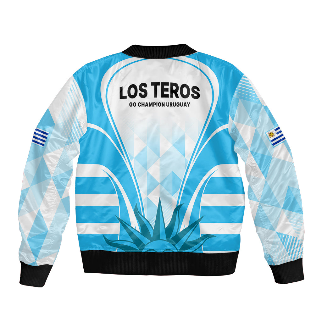 Light blue bomber jacket, black ribbed hem and cuffs; Los Teros back graphic and flag patch
