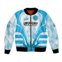 Light blue rugby bomber jacket with full-zip front, black ribbed cuffs, Uruguay logo graphic