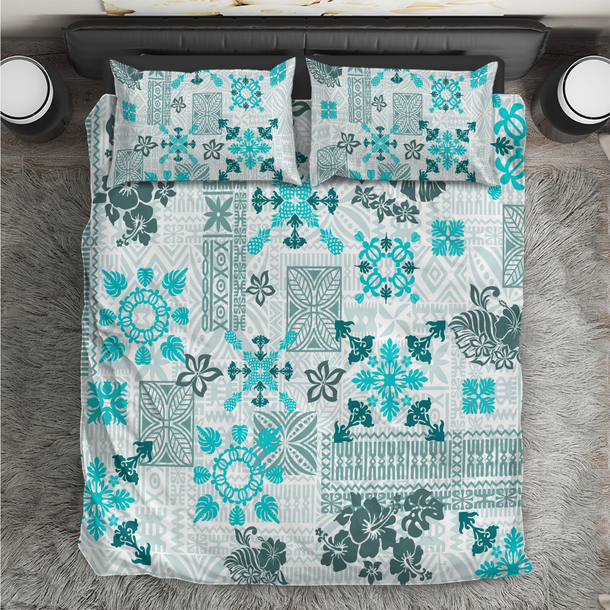 Aqua tribal-pattern quilt bedding set with matching pillow shams, front view on bed