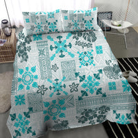 Aqua tribal quilt bedding set with two matching pillow shams, angled view