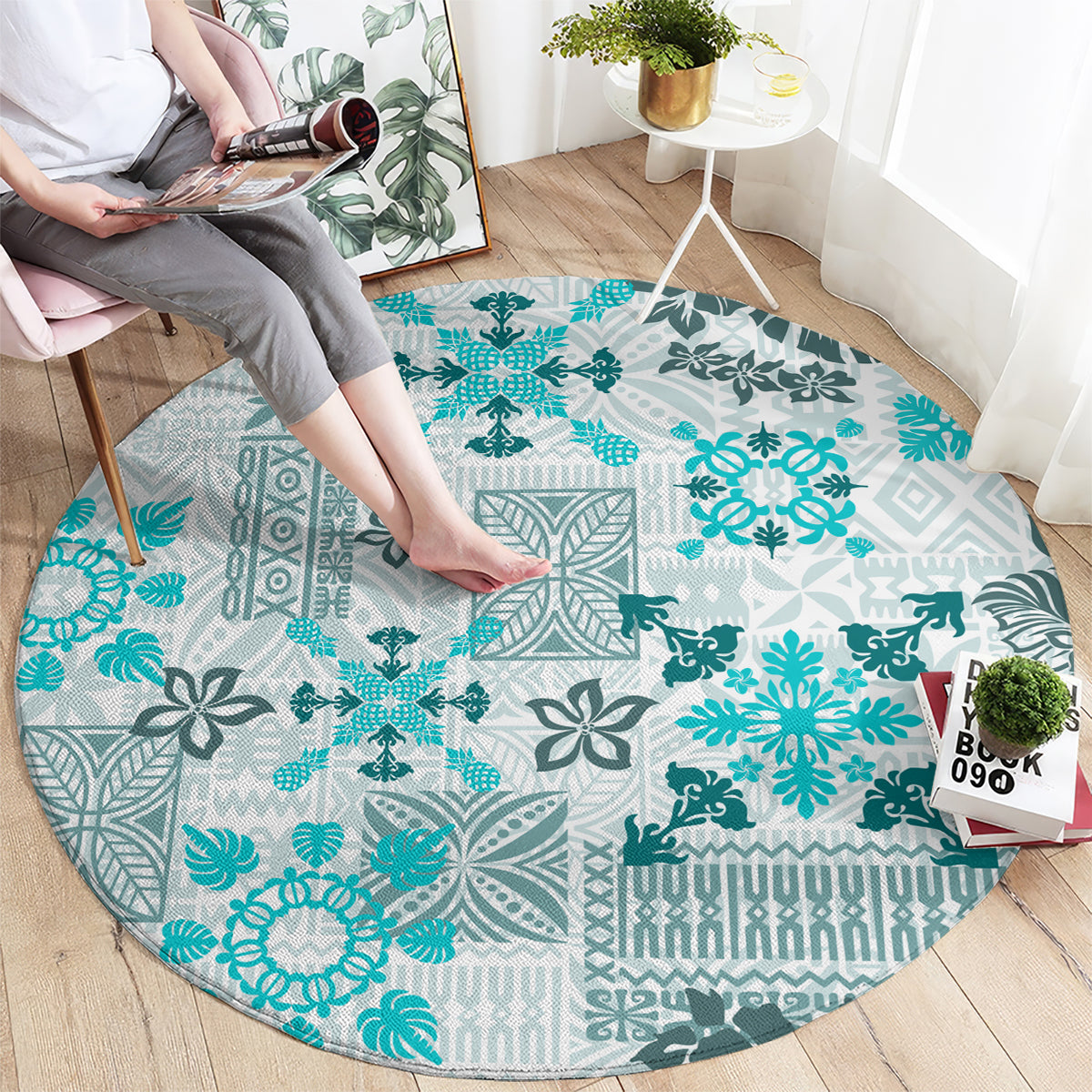 Round aqua carpet with tapa tribal quilt pattern and teal floral motifs