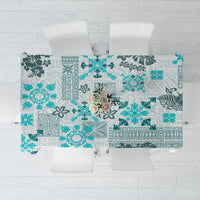 Aqua patchwork-style tablecloth with teal tropical quilt and tapa patterns
