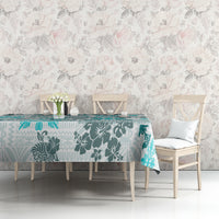 Aqua tablecloth with teal tropical tapa and leaf quilt patchwork pattern on bench