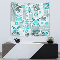 Aqua and white quilt-style tribal tapestry with detailed floral and patterned blocks