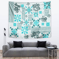 Aqua and white quilt-style tribal tapestry with dense patchwork florals and icons