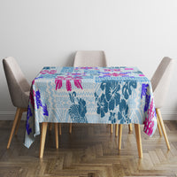 Blue Hawaiian quilt-pattern tablecloth with floral tapa tribal motifs and magenta trim