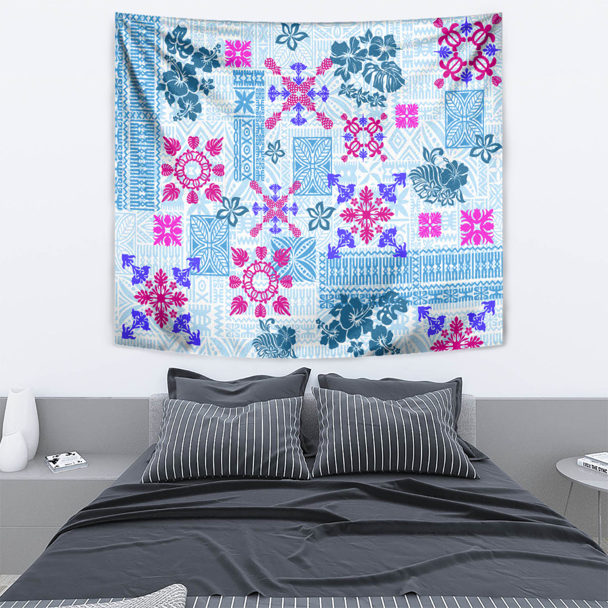 Blue rectangular quilt tapestry with pink and teal floral-geometric patchwork pattern