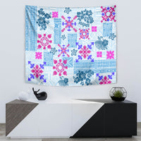 Wall-hung blue quilt tapestry with pink and teal floral and geometric block pattern