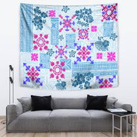 Blue rectangular quilt tapestry with pink and teal floral motifs and patterned border