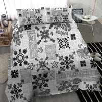 Black-and-white tribal print quilt bedding set with matching patterned pillowcases