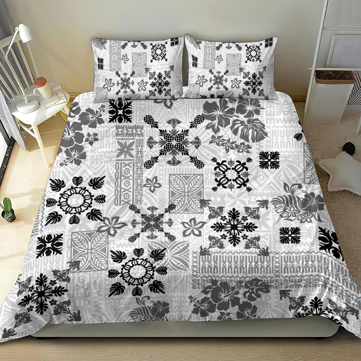 White bed quilt set with black tribal patchwork and two matching pillowcases
