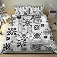 White bed quilt set with black tribal patchwork and two matching pillowcases