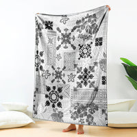 Black and white Hawaiian quilt blanket hanging with tapa tribal floral design
