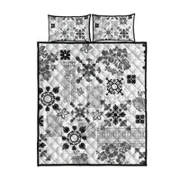 Black and white tribal quilt bed set with two matching pillow shams