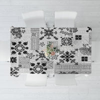 Folded black and white tapa tribal tablecloth featuring mixed quilt pattern blocks