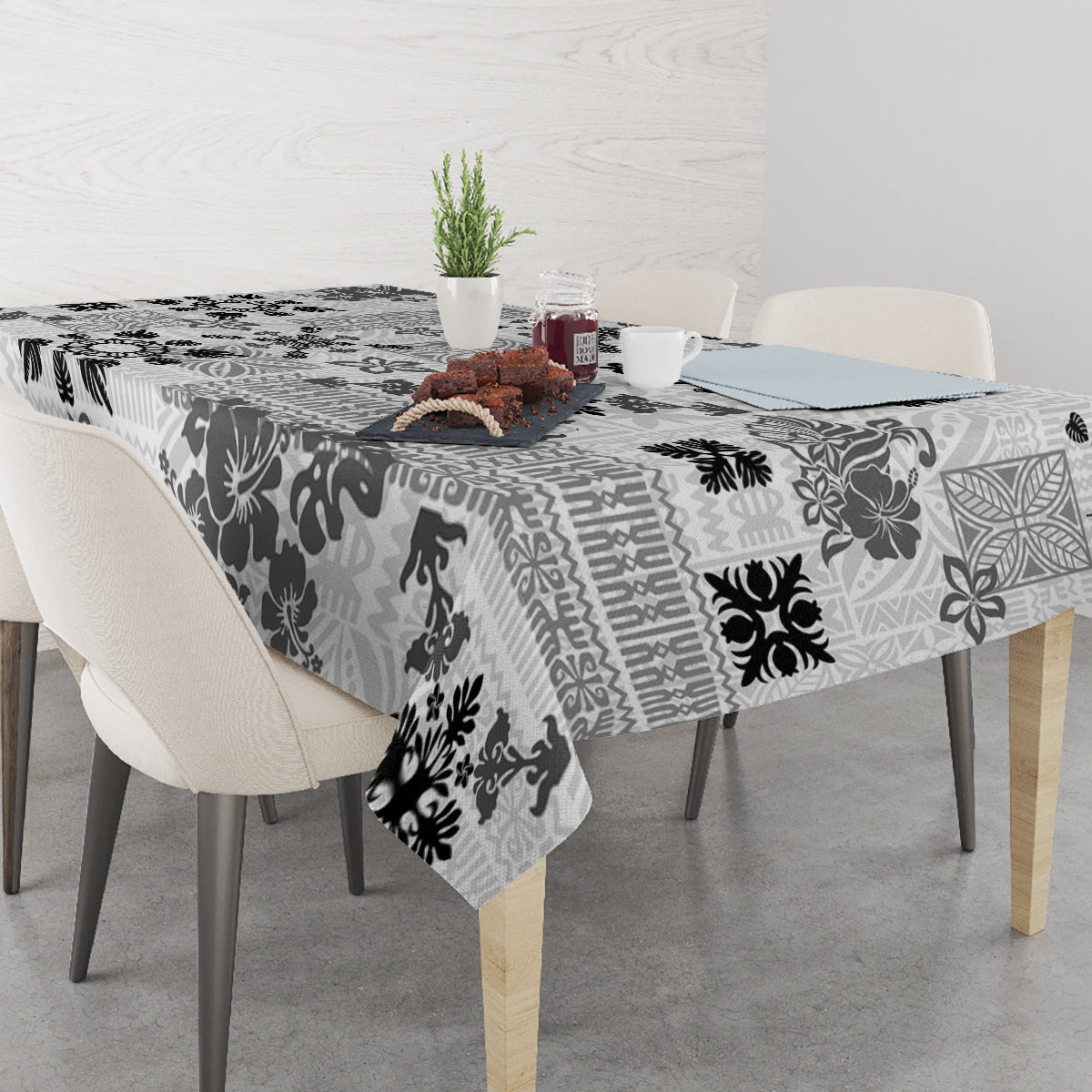 Black and white floral tribal tablecloth with decorative tapestry pattern over table