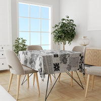 Black and white tapa tribal tablecloth with quilt motifs on dining table