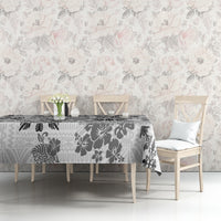 Black and white tribal quilt tablecloth with ornate tapa-style motifs on dining table