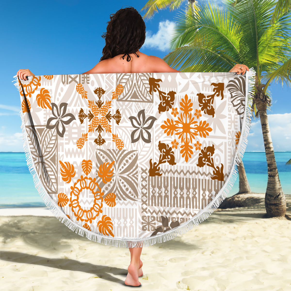 Beach blanket with fringe edge, white fabric with orange-brown floral and geometric tapa print