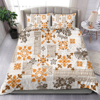Gold and white tropical tribal quilt bedding set with matching pillow shams
