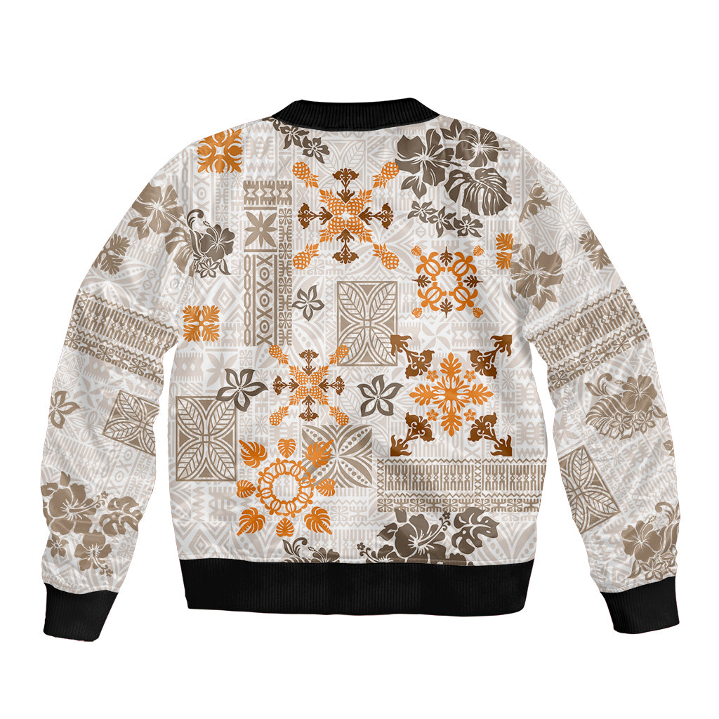 Unisex bomber jacket, front zip and black ribbed cuffs, white with orange tribal quilt print.