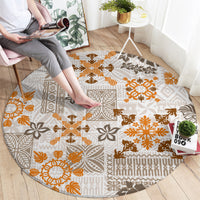 Round tapa tribal round carpet with beige background and orange-brown geometric quilt motif