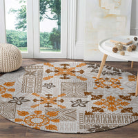 Round tapa tribal carpet with beige base and orange-brown woven geometric quilt design