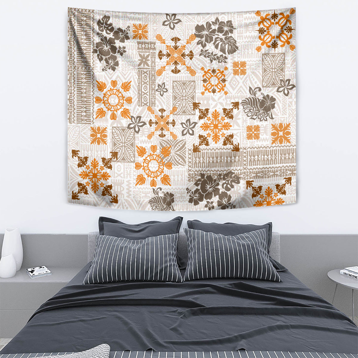 Fringed wall tapestry in white with orange and dark brown floral quilt patchwork