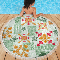 Round beach blanket with white fringe border, green quilt pattern with red orange floral prints