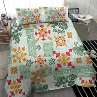 Green Hawaiian quilt bedding set with detailed tapa tribal pattern and red orange flowers