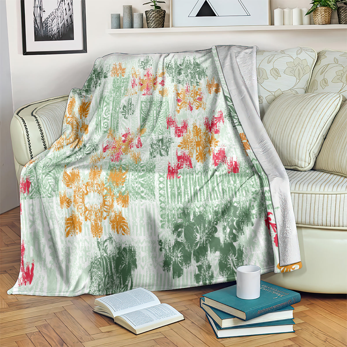 Green tapa tribal quilt blanket with multicolor floral motifs on a couch