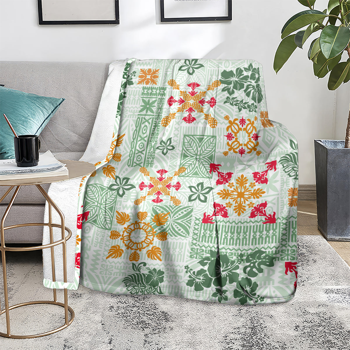 Green tropical tapa tribal blanket spread on a sofa with colorful floral pattern