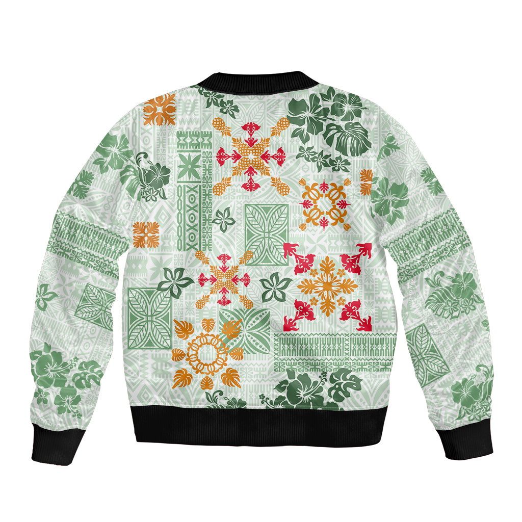 Green bomber jacket with tropical quilt pattern, black ribbed hem and sleeves cuffs.