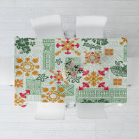 Green Hawaiian quilt-style tablecloth with tapa tribal and floral pattern