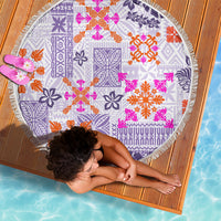 Round violet beach blanket with fringed edge, quilt tribal print, viewed from above.