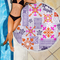 Violet round fringed beach blanket with Hawaiian quilt tribal pattern, poolside close-up.
