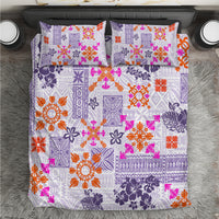 Violet quilt and two pillow shams with colorful Hawaiian tapa tribal pattern.