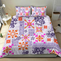 Violet tapa tribal quilt set with two pillow shams and colorful geometric motifs.