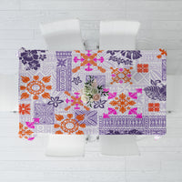 Violet tablecloth with floral and geometric patchwork pattern in orange and pink