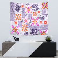 Violet quilt-pattern tapestry featuring floral tapa motifs in orange, pink, and dark purple