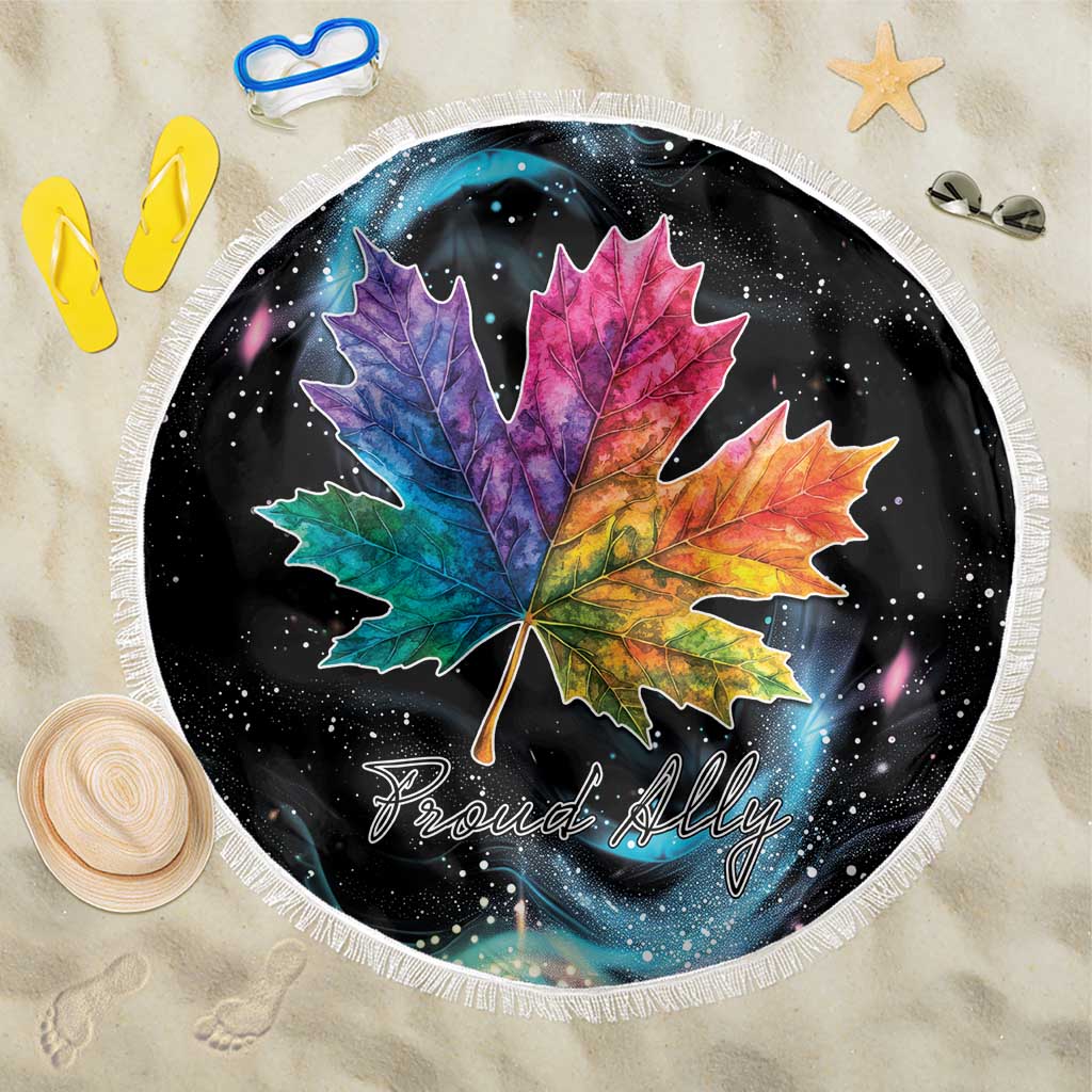Round black beach blanket with colorful maple leaf design and white fringe trim
