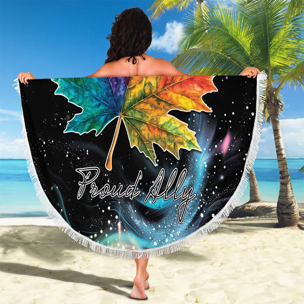 Round black beach blanket with multicolor maple leaf center and white fringe trim