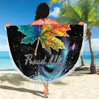 Round black beach blanket with multicolor maple leaf center and white fringe trim