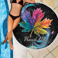 Round black beach blanket with rainbow maple leaf and Proud Ally text, white fringe
