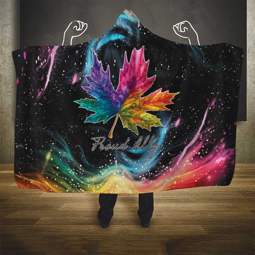 Black hooded blanket with rainbow maple leaf graphic and galaxy nebula, with hood up